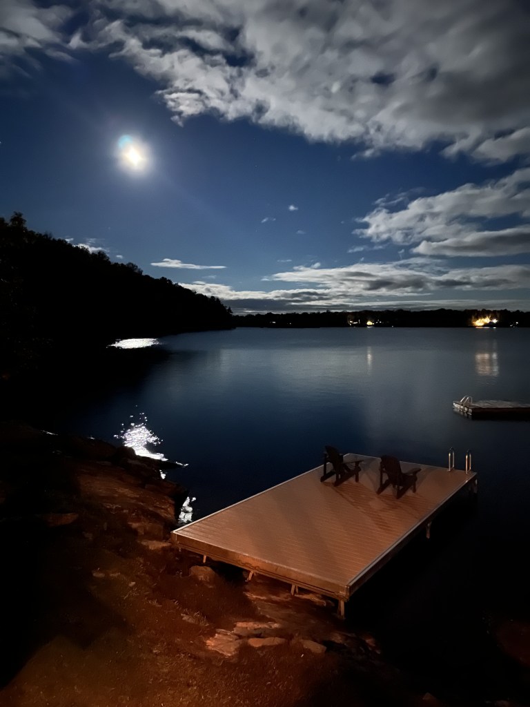 Bright moon overlooking Oak Lake in Havelock, Ontario at The Trace Resort.